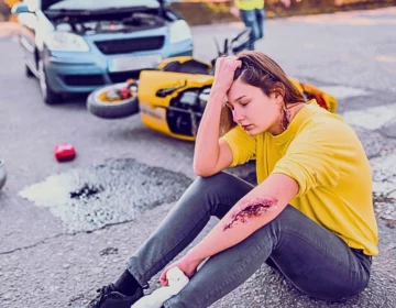 Female Still In Shock After Getting Hit By Car With Motorcycle. impact of motorcycle accident injuries
