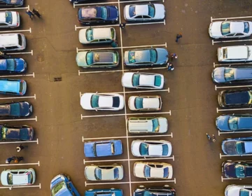 Aerial view of cars parked in a lot. Dangerous Parking Lots