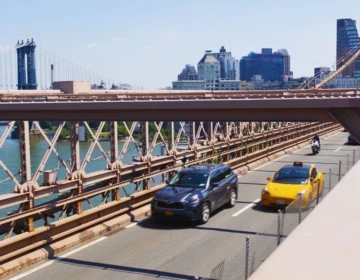 Cars driving across the iconic Brooklyn Bridge in New York. Bridge and Ramp Accidents in Cincinnati