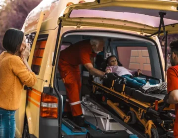 A mother worried because her son is in an ambulance because he had an accident. Child Was Hurt in a Car Accident
