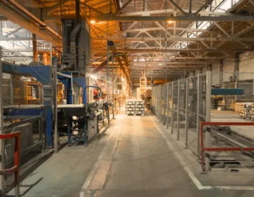 A huge industrial warehouse filled with equipment, materials, and tools