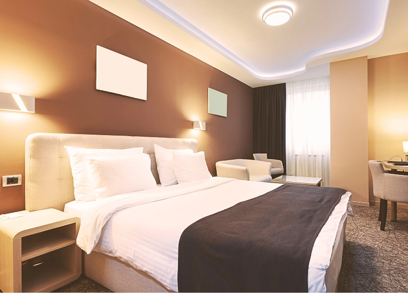 A tidy brown and tan hotel room where someone was injured.